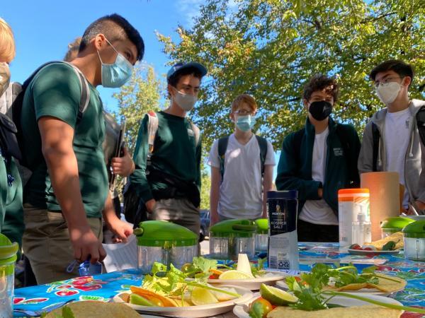 Group of students observing a food demonstration at Brooklyn Urban Gardens Charter School