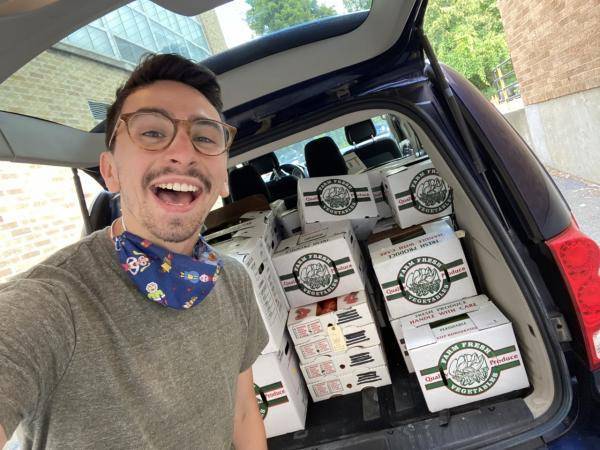 Photo of Nick Weith with a trunk full of pork
