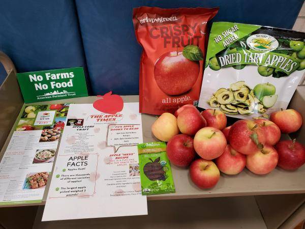 Table of New York apples and promotional materials