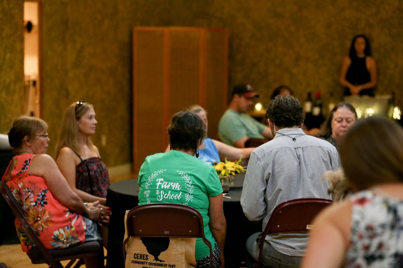People convene at tables during the New York Farm to School Institute