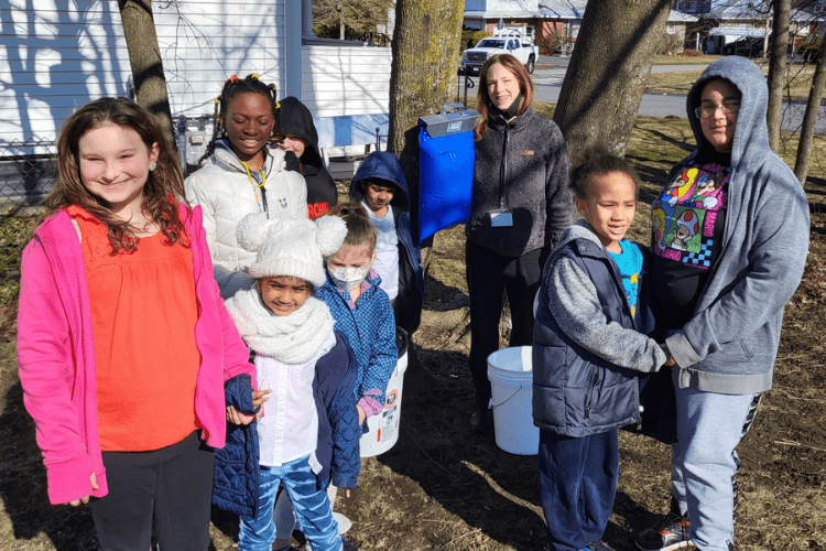 Students with tapped maple tree